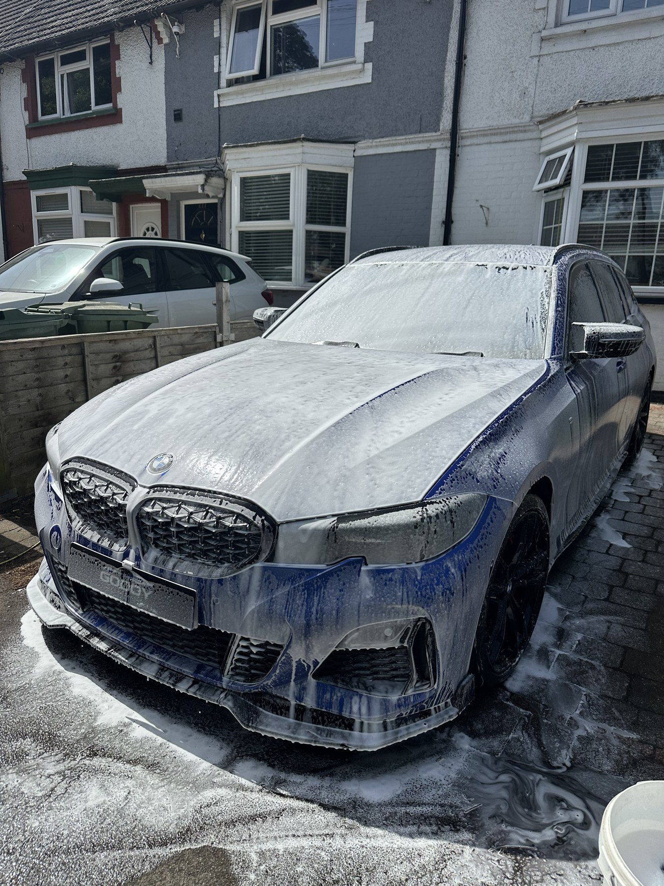 Blue BMW foam wash before detailing
